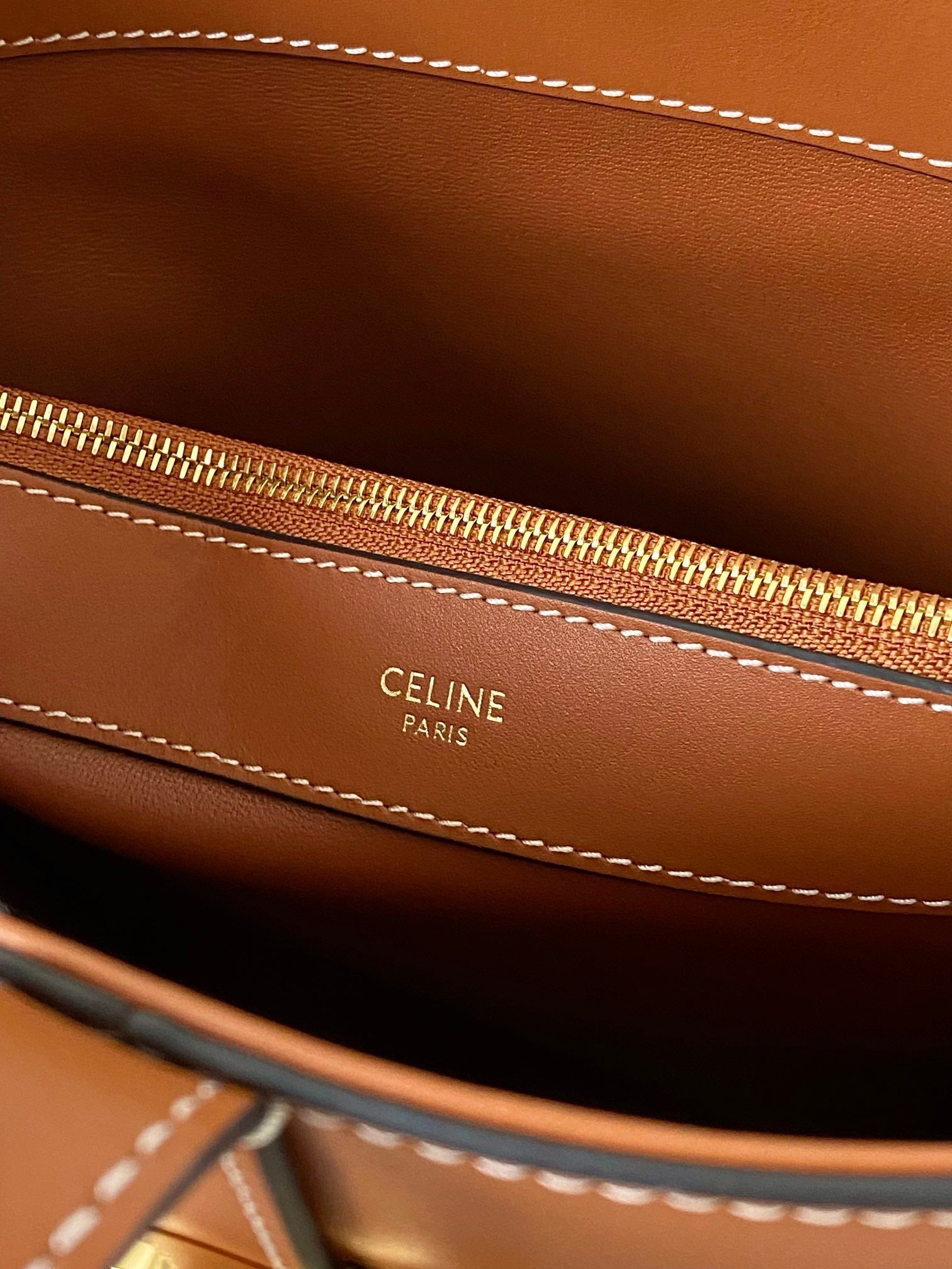 TRIOMPHE 25 BUCKET BAG CINNAMON BROWN CALFSKIN