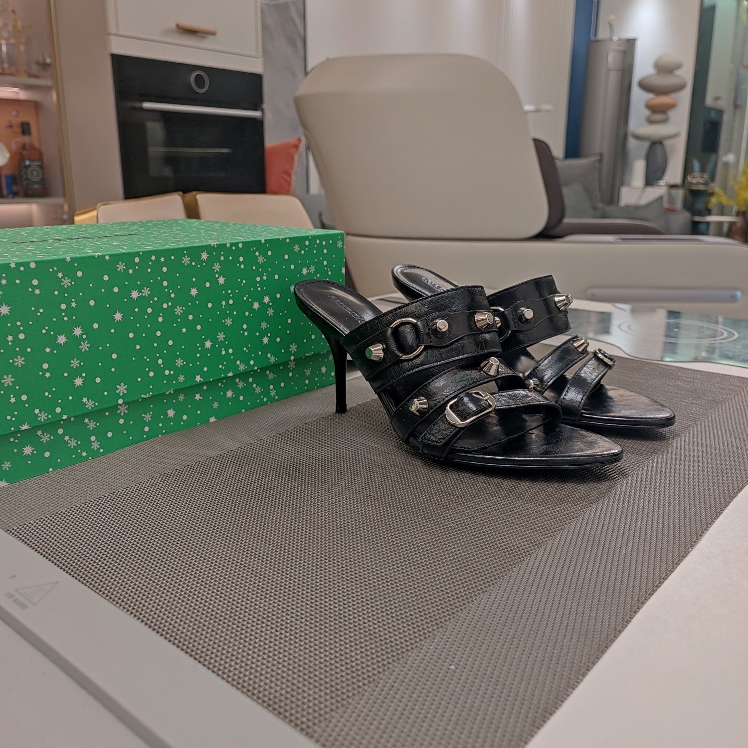STRAPPY HIGH-HEELED SANDALS IN BLACK STUDDED WAX-OIL SHEEPSKIN